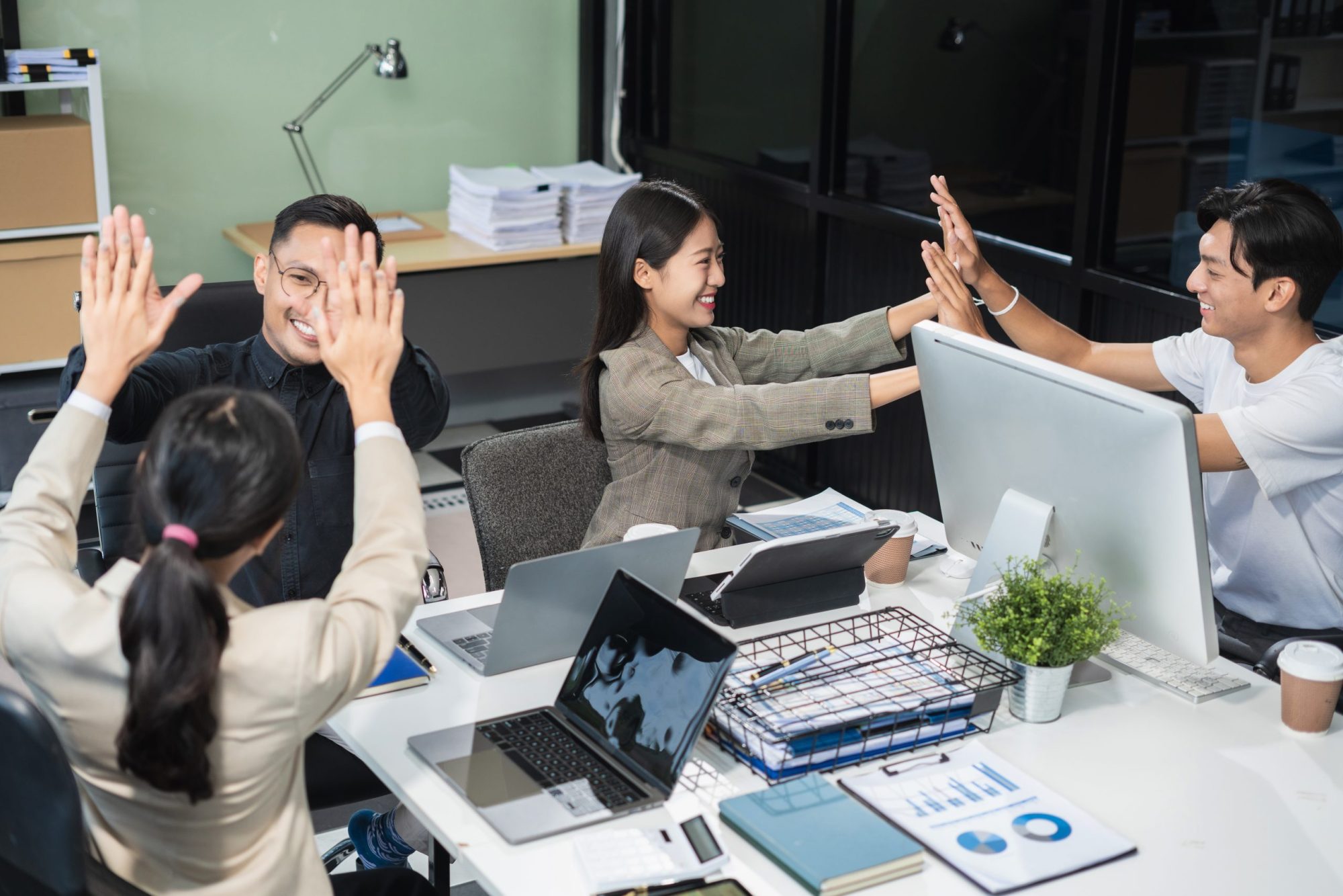 businesspeople coworker in office Happy to be successful partnership teamwork success concept.