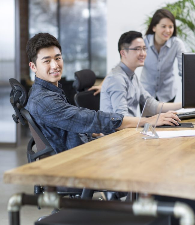 Chinese IT workers developing digital tablet